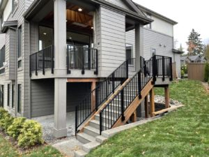 a house with a balcony and stairs