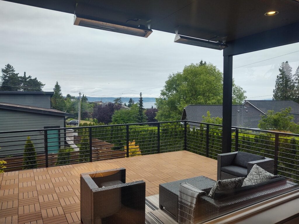 Modern horizontal metal railing at an Everett residential entrance