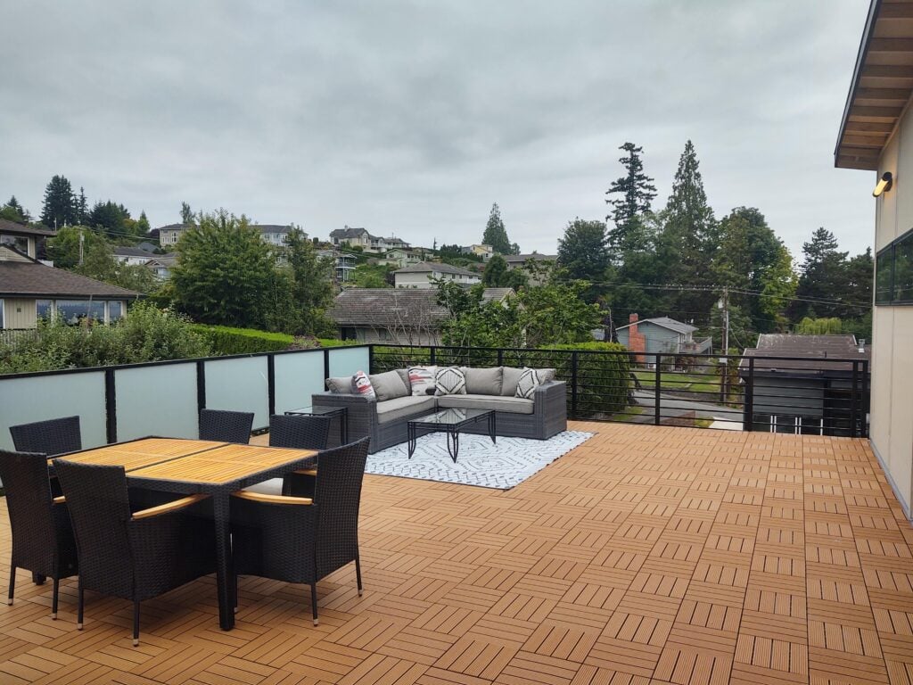 Black horizontal residential railing along an Everett entry deck