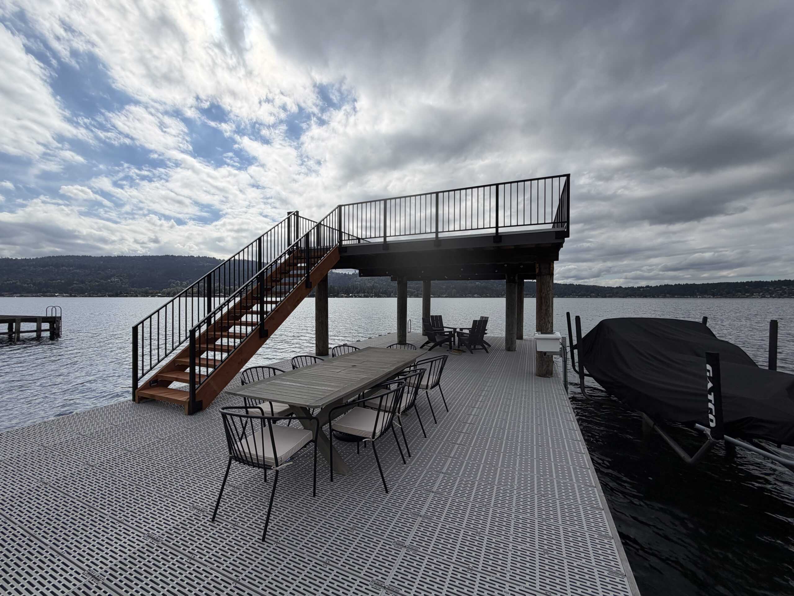 Black aluminum picket railings around the Lake Sammamish dock deck